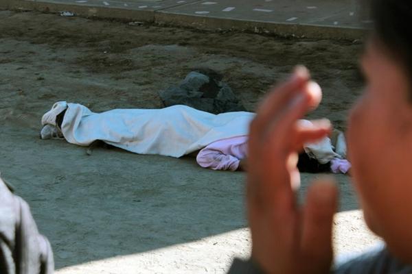 El cuerpo de María Thelma  García, de 29 años, fue encontrado en la 0  avenida de la zona 7 de la cabecera de Quetzaltenango. (Foto Prensa  Libre:  Carlos Ventura)