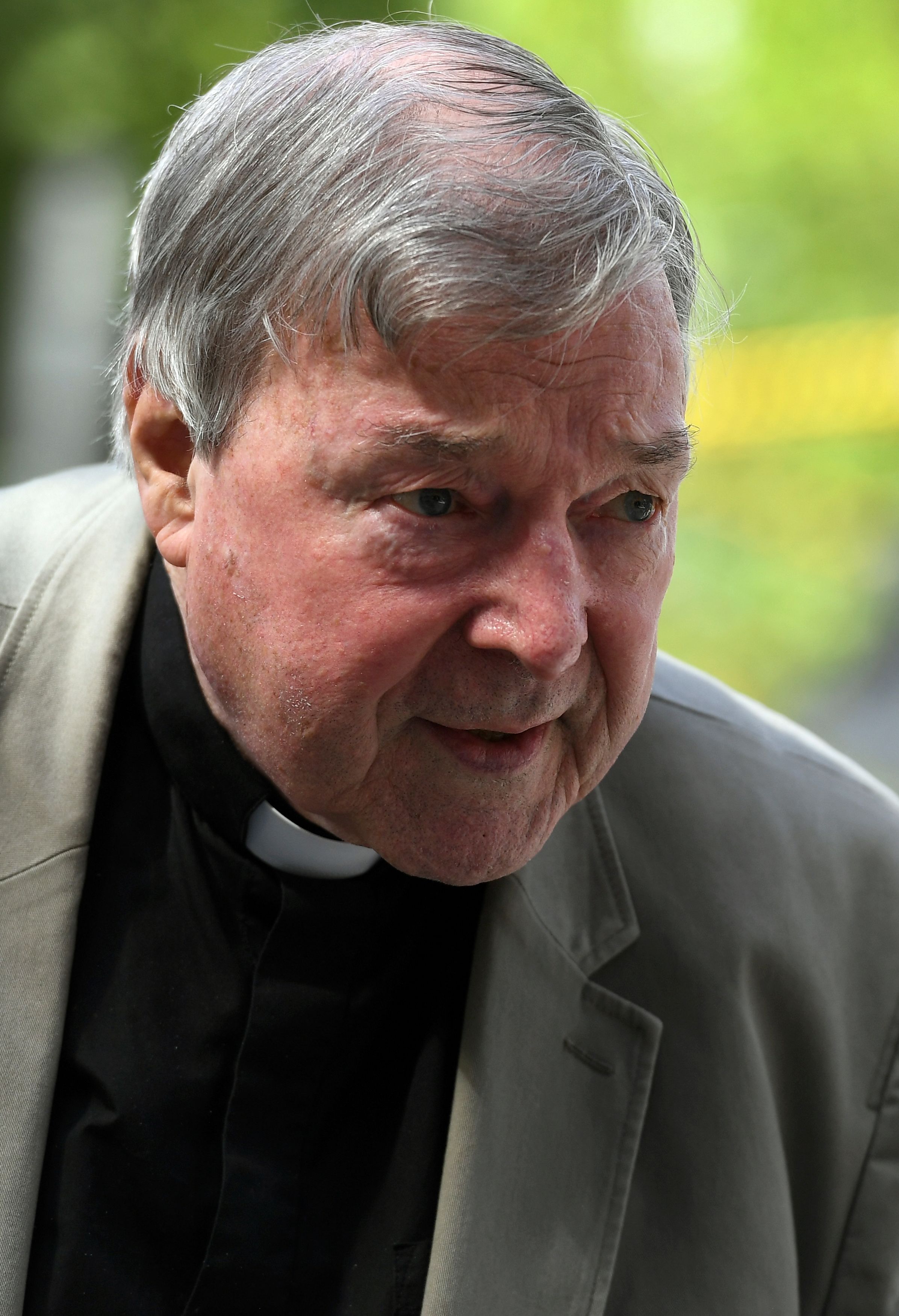 Cardinal George Pell walks from a car in Melbourne on February 14, 2019. - Pell is facing prosecution for historical child sexual offences. (Photo by William WEST / AFP)