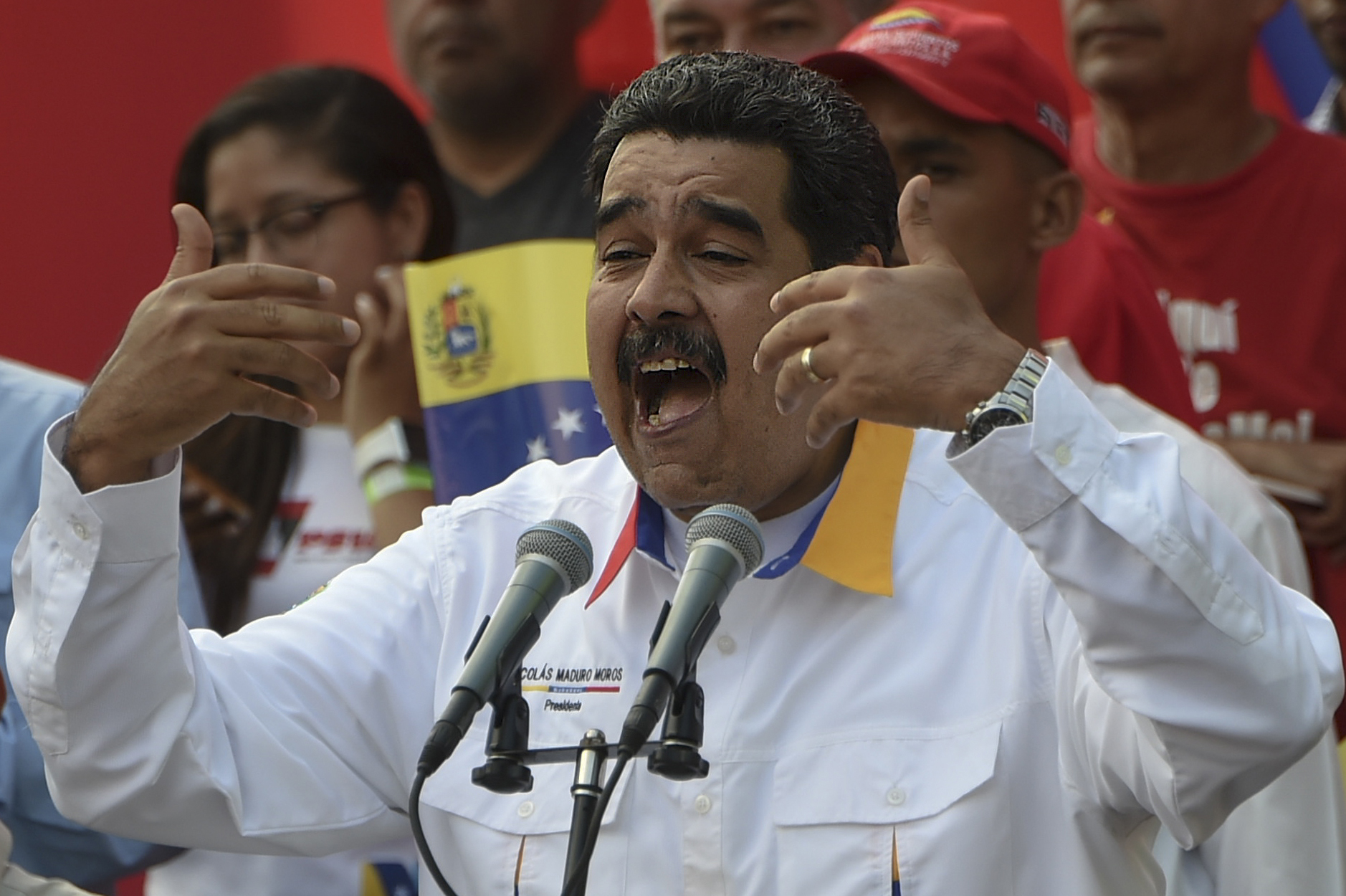 Venezuelan President Nicolas Maduro delivers a speech during a pro-government demonstration in Caracas on March 23, 2019. - It is two months since Juan Guaido has asserted he is Venezuela's interim president. Domestically, he has been unable to shake President Nicolas Maduro from power. (Photo by Juan BARRETO / AFP)