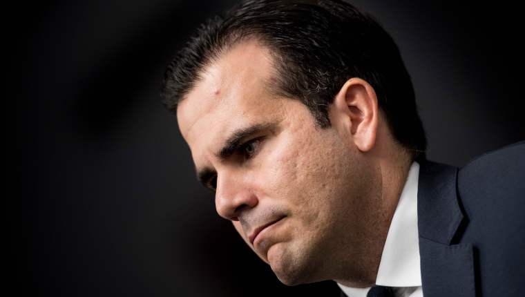 (FILES) In this file photo taken on January 10, 2018 Puerto Rico's Governor Ricardo Rossello listens during a press conference on Capitol Hill in Washington, DC. - Puerto Rico's Governor Ricardo Rossello announced on July 21, 2019 that he will not seek reelection next year after more than a week of protests demanding his resignation following the release of compromising chats. (Photo by Brendan Smialowski / AFP)