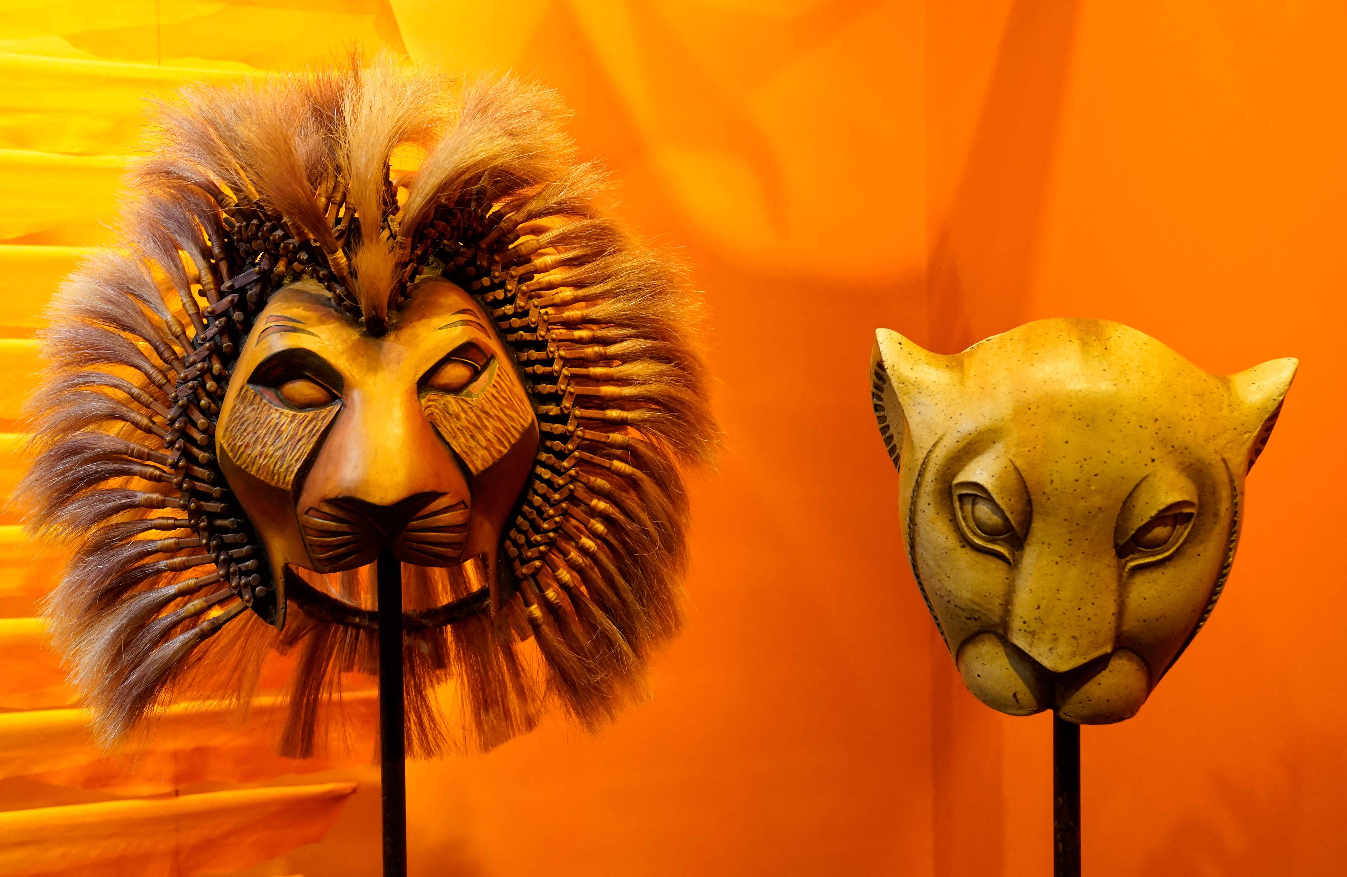 Masks from The Lion King are on display during the grand opening of the new Museum of Broadway in Times Square, New York City on November 15, 2022. - The first ever permanent Museum dedicated to the history of Broadway musicals, plays, and theatres, officially opened to the public on Tuesday. (Photo by TIMOTHY A. CLARY / AFP)