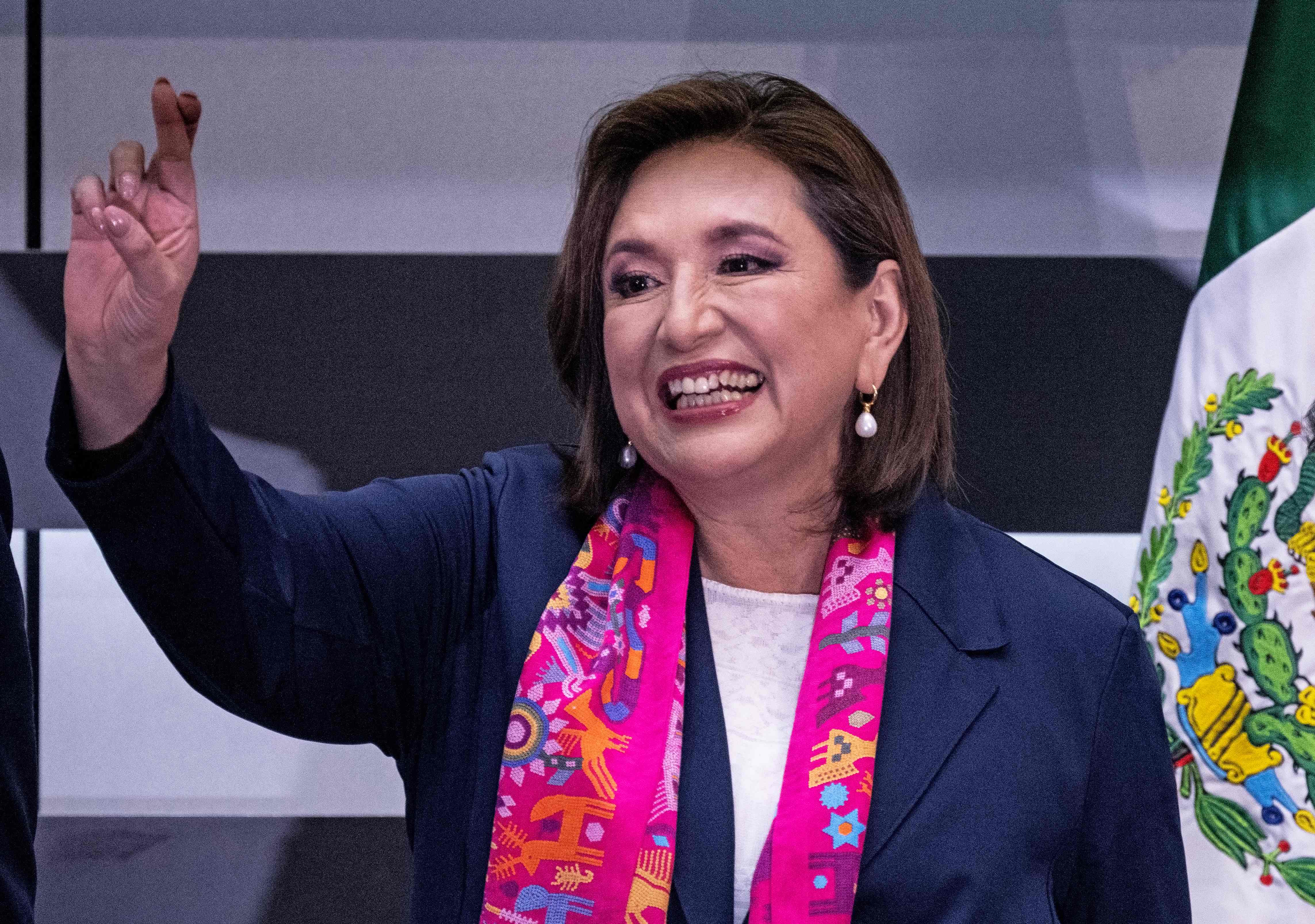 Opposition candidate Xochitl Galvez of the Fuerza y Corazon por Mexico coalition party gestures as she officially registers as a presidential candidate for the upcoming June 2, 2024, general election at the National Electoral Institute (INE) in Mexico City, Mexico, on February 20, 2024. (Photo by CARL DE SOUZA / AFP)