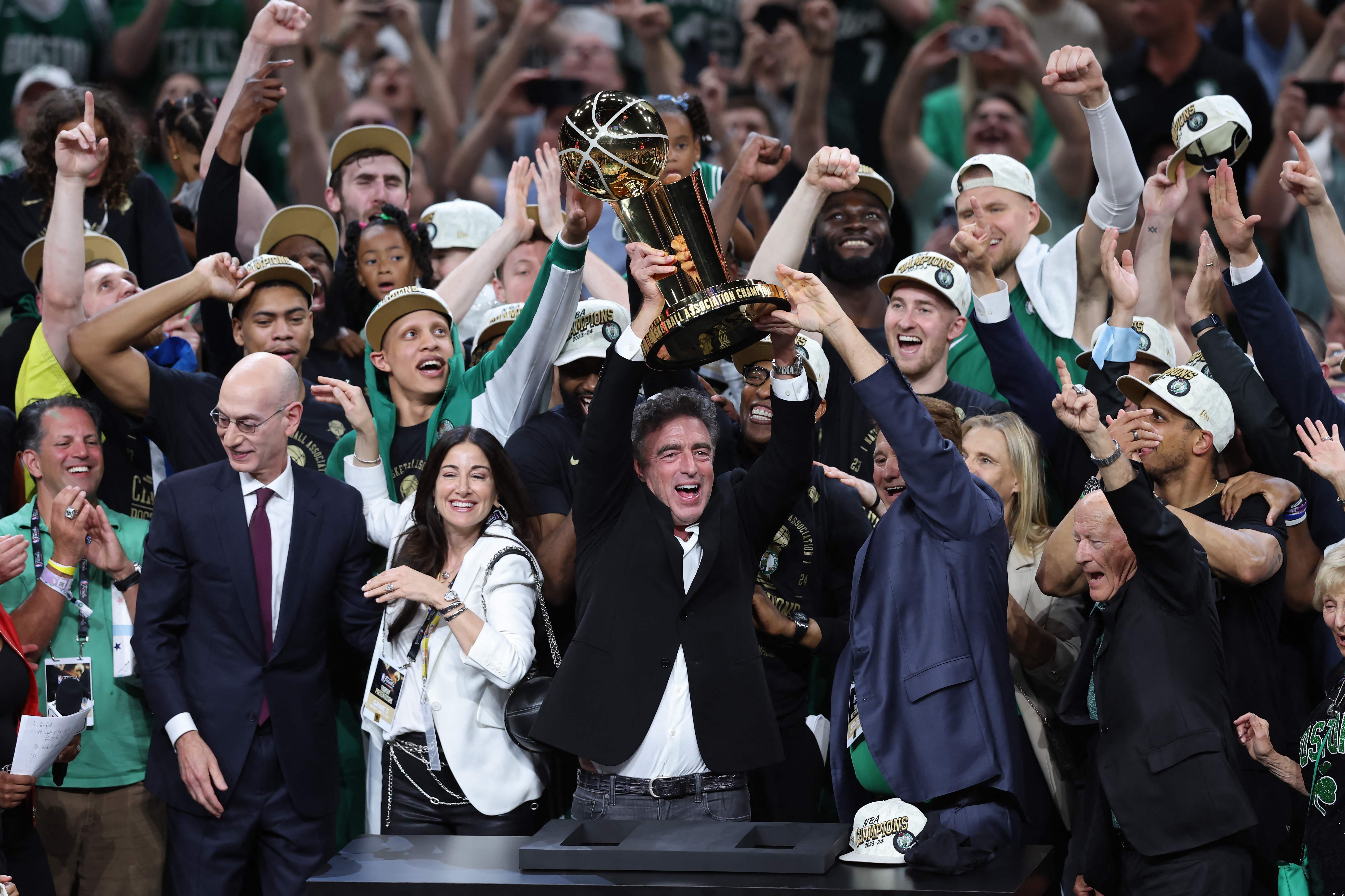 Majority owner Wyc Grousbeck of the Boston Celtics holds up the the Larry OBrien Championship Trophy after Boston's 106-88 win against the Dallas Mavericks in Game Five of the 2024 NBA Finals at TD Garden on June 17, 2024 in Boston, Massachusetts. NOTE TO USER: User expressly acknowledges and agrees that, by downloading and or using this photograph, User is consenting to the terms and conditions of the Getty Images License Agreement.   Adam Glanzman/Getty Images/AFP (Photo by Adam Glanzman / GETTY IMAGES NORTH AMERICA / Getty Images via AFP)