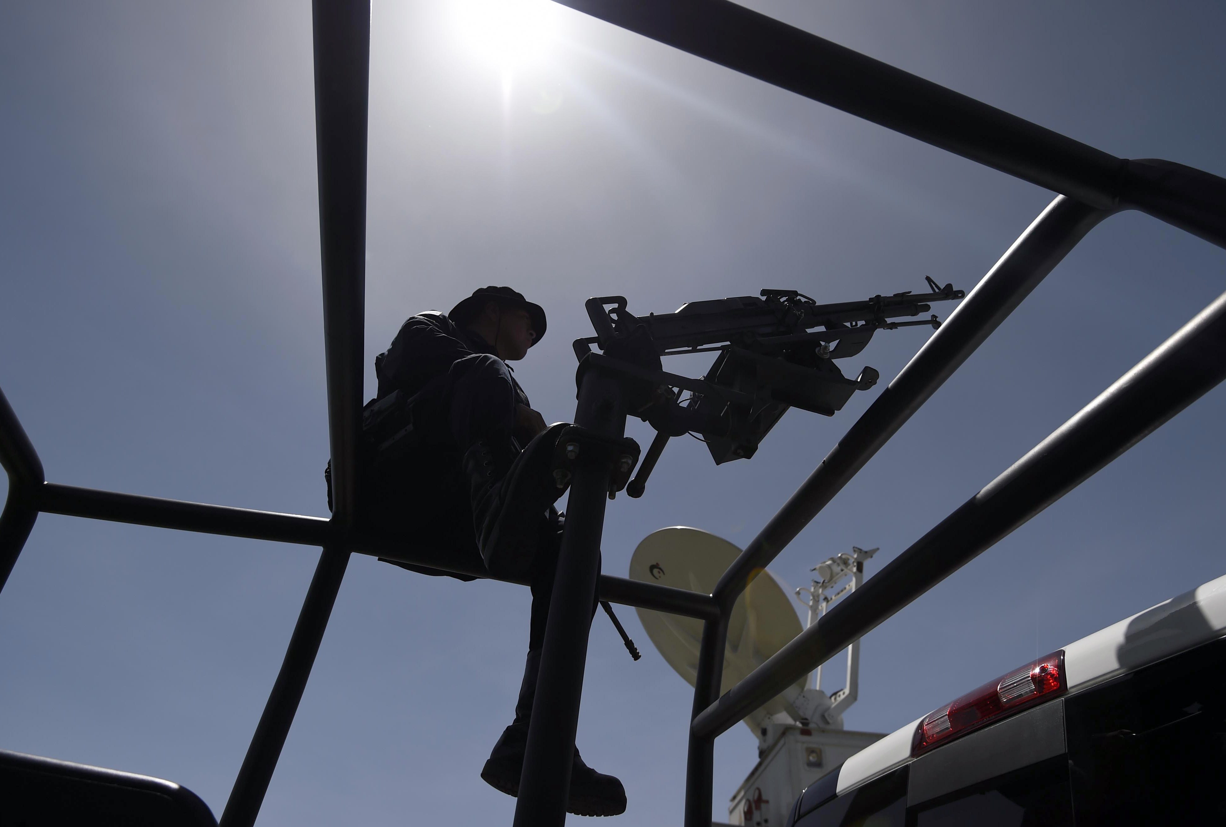 Federal Police officers patrol the perimeter of the Altiplano prison in Almoloya de Juarez, Mexico, on July 13, 2015 a day after the government informed of the escape of drug kingpin Joaquin "El Chapo" Guzman from the maximum-security prison. Mexican security forces scrambled Monday to save face and recapture drug kingpin Joaquin "El Chapo" Guzman as authorities investigated whether guards helped him escape prison through a tunnel under his cell.   AFP PHOTO / ALFREDO ESTRELLA