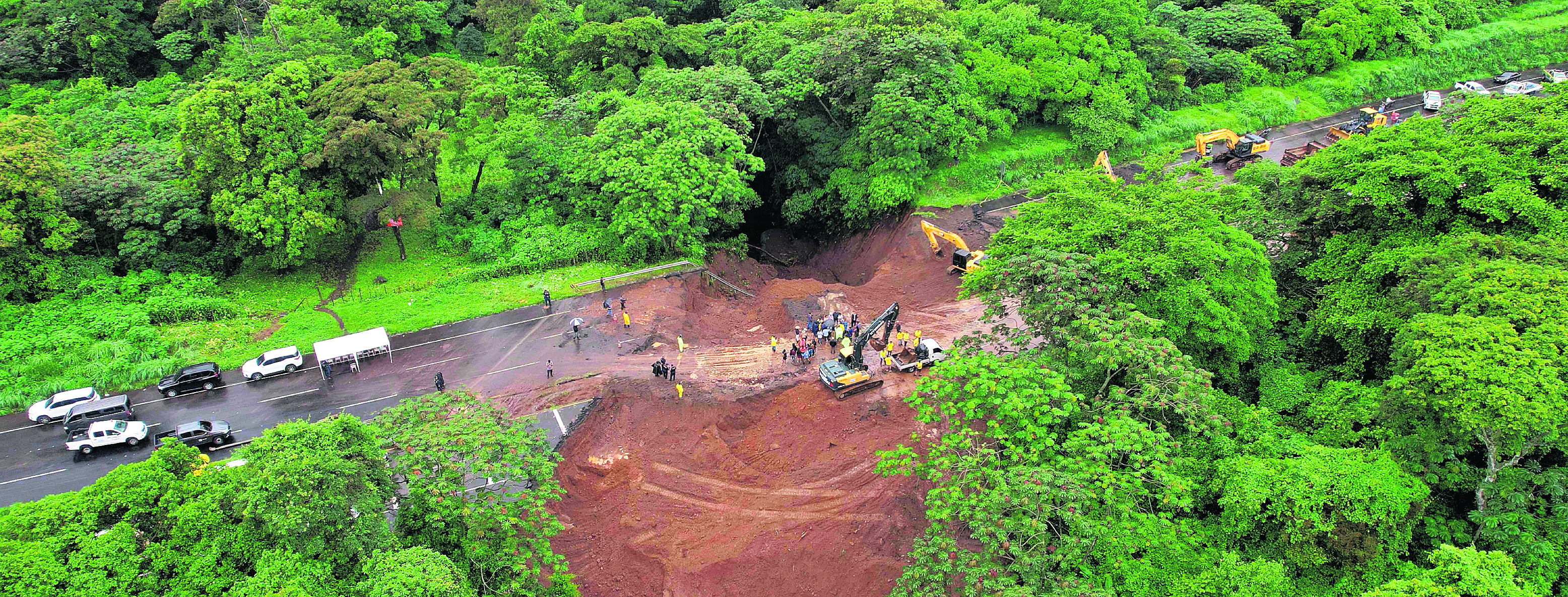 Aerial view of a landslide on the Palin-Escuintla highway due to the heavy rains near Guatemala City on June 16, 2024. Six people died and thousands have been affected in El Salvador and Guatemala due to heavy rains that hit Central America since June 15, according to authorities from both countries. (Photo by Jesus MIRANDA / AFP)