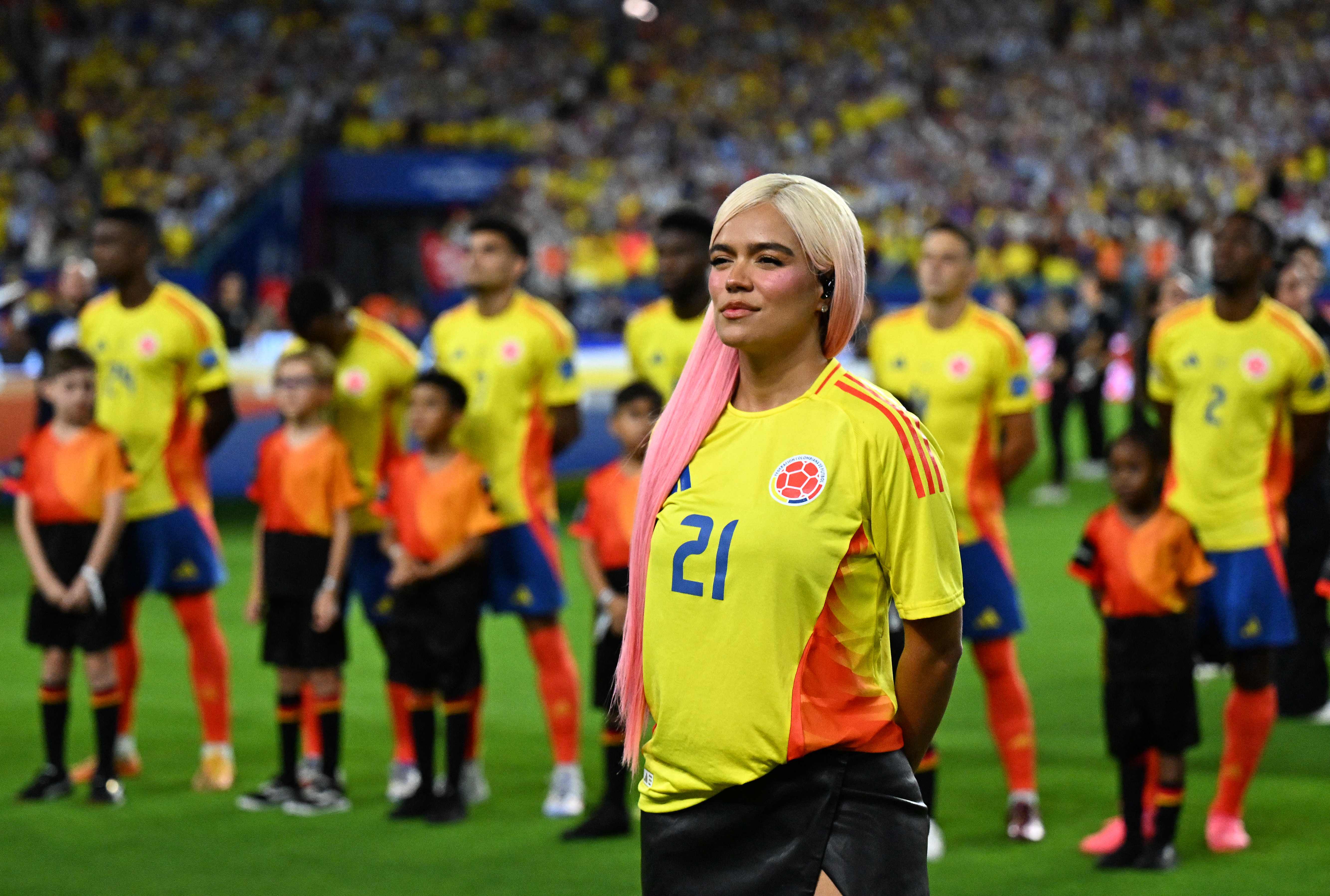 Colombian singer Karol G gestures ahead of the Conmebol 2024 Copa America tournament final football match between Argentina and Colombia at the Hard Rock Stadium, in Miami, Florida on July 14, 2024. (Photo by Chandan Khanna / AFP)