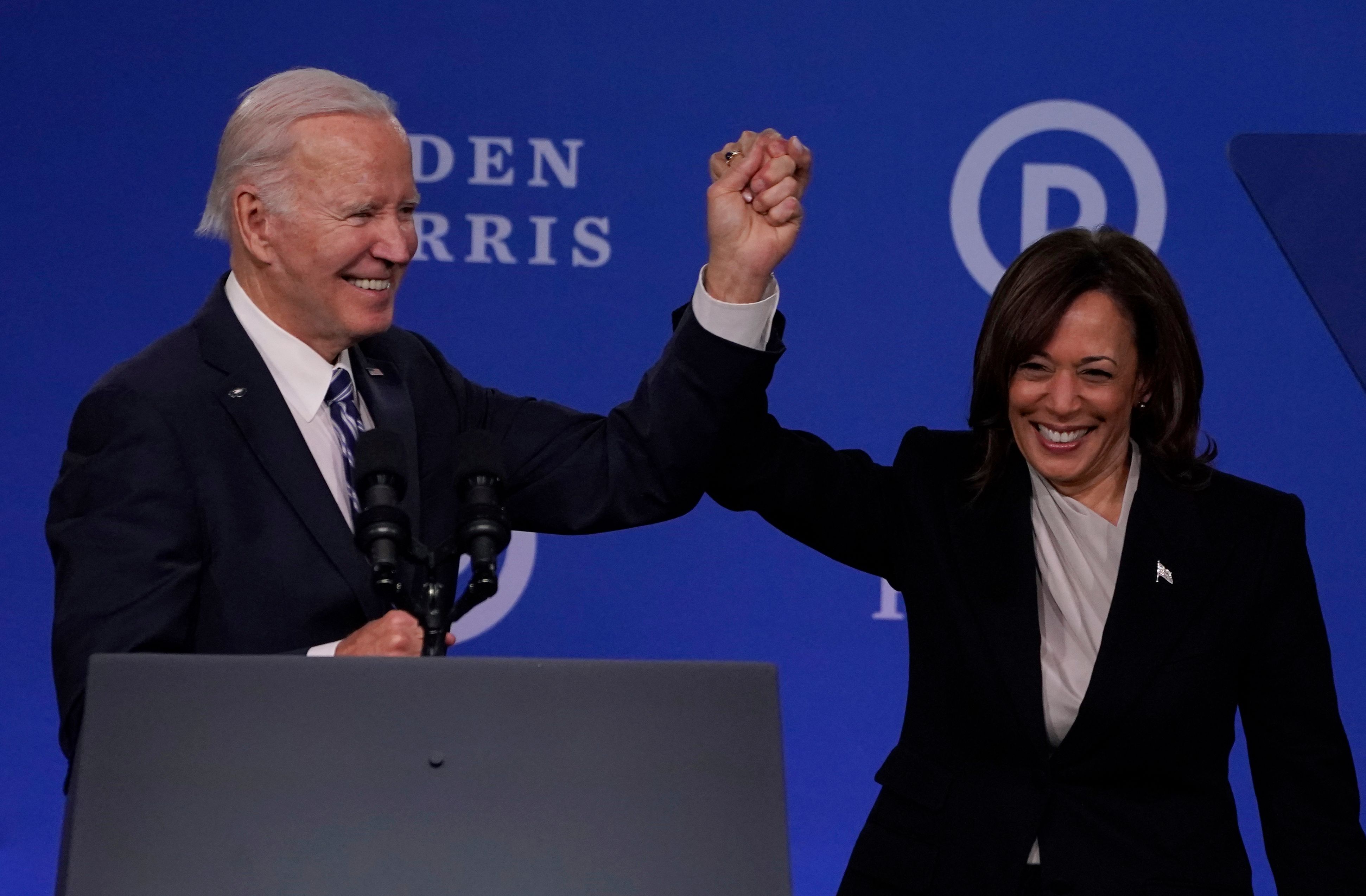 (FILES) US Vice President Kamala Harris and US President Joe Biden hold hands at the Democratic National Committee (DNC) 2023 Winter meeting in Philadelphia, Pennsylvania, on February 3, 2023. US President Joe Biden announced July 21, 2024 that he is dropping out of his reelection battle with Donald Trump, in a historic move that plunges the already turbulent 2024 White House race into uncharted territory. Biden also said he was endorsing Vice President Kamala Harris as the Democratic nominee for the 2024 election after he dropped out of the race. (Photo by TIMOTHY A. CLARY / AFP)