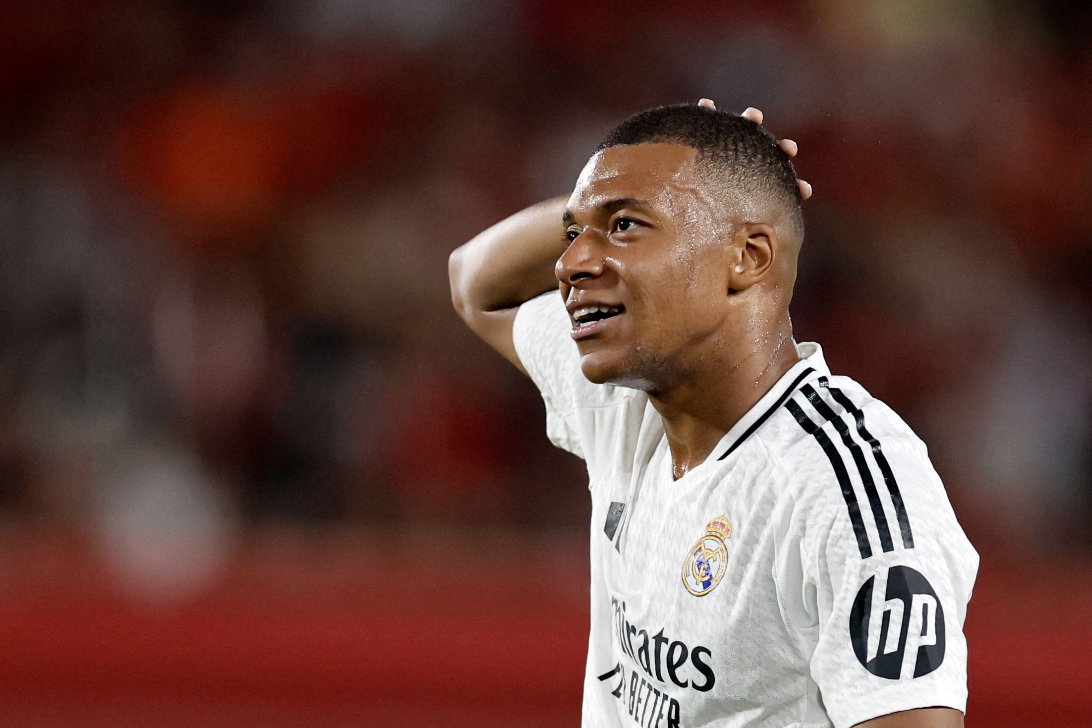 Real Madrid's French forward #09 Kylian Mbappe reacts during the Spanish league football match between RCD Mallorca and Real Madrid CF at the Mallorca Son Moix stadium in Palma de Mallorca on August 18, 2024. (Photo by OSCAR DEL POZO / AFP)