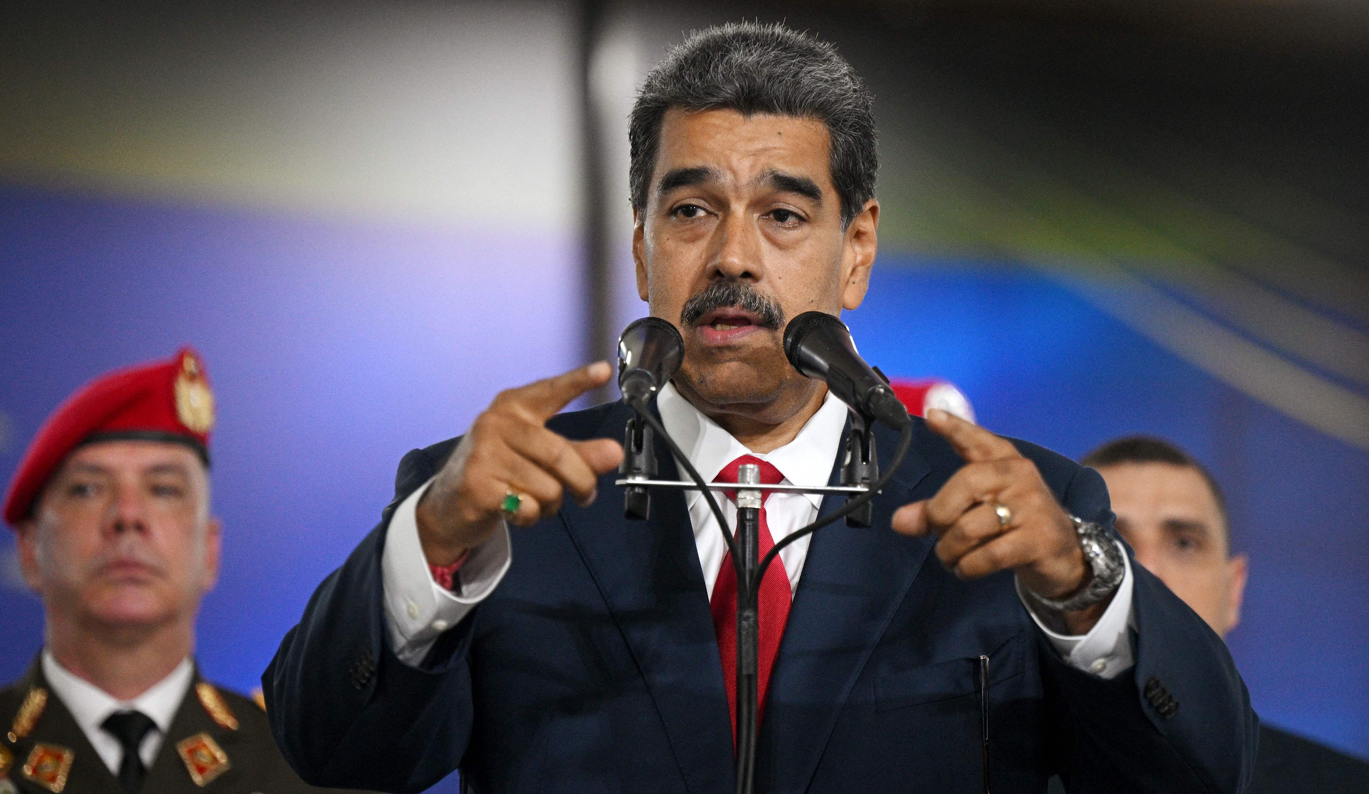 Venezuelan President Nicolas Maduro speaks to the media at the Venezuela's Supreme Court of Justice (TSJ) in Caracas on August 2, 2024. The ruling TSJ summoned candidates of last presidential election, accused by the opposition of being fraudulent, after accepting an appeal by the proclaimed winner Nicolas Maduro for the highest court to certify the process. (Photo by Federico PARRA / AFP)