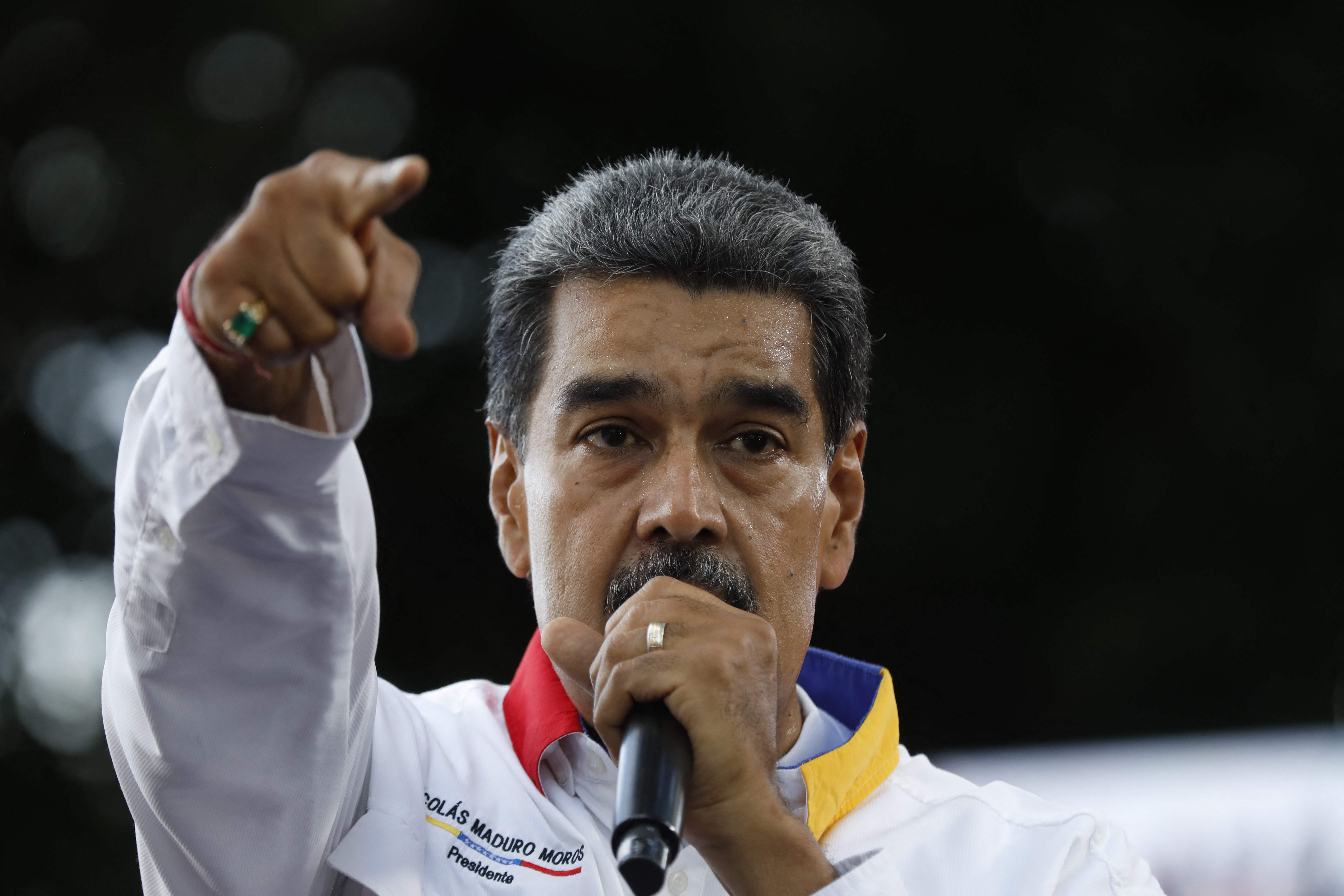 Venezuelan President Nicolas Maduro speaks to supporters during a rally in Caracas on August 3, 2024. Venezuela braced for fresh protests after President Nicolas Maduro's disputed election victory was ratified on the eve -- and a growing number of nations recognized his opposition rival as the true winner. (Photo by Pedro Rances Mattey / AFP)