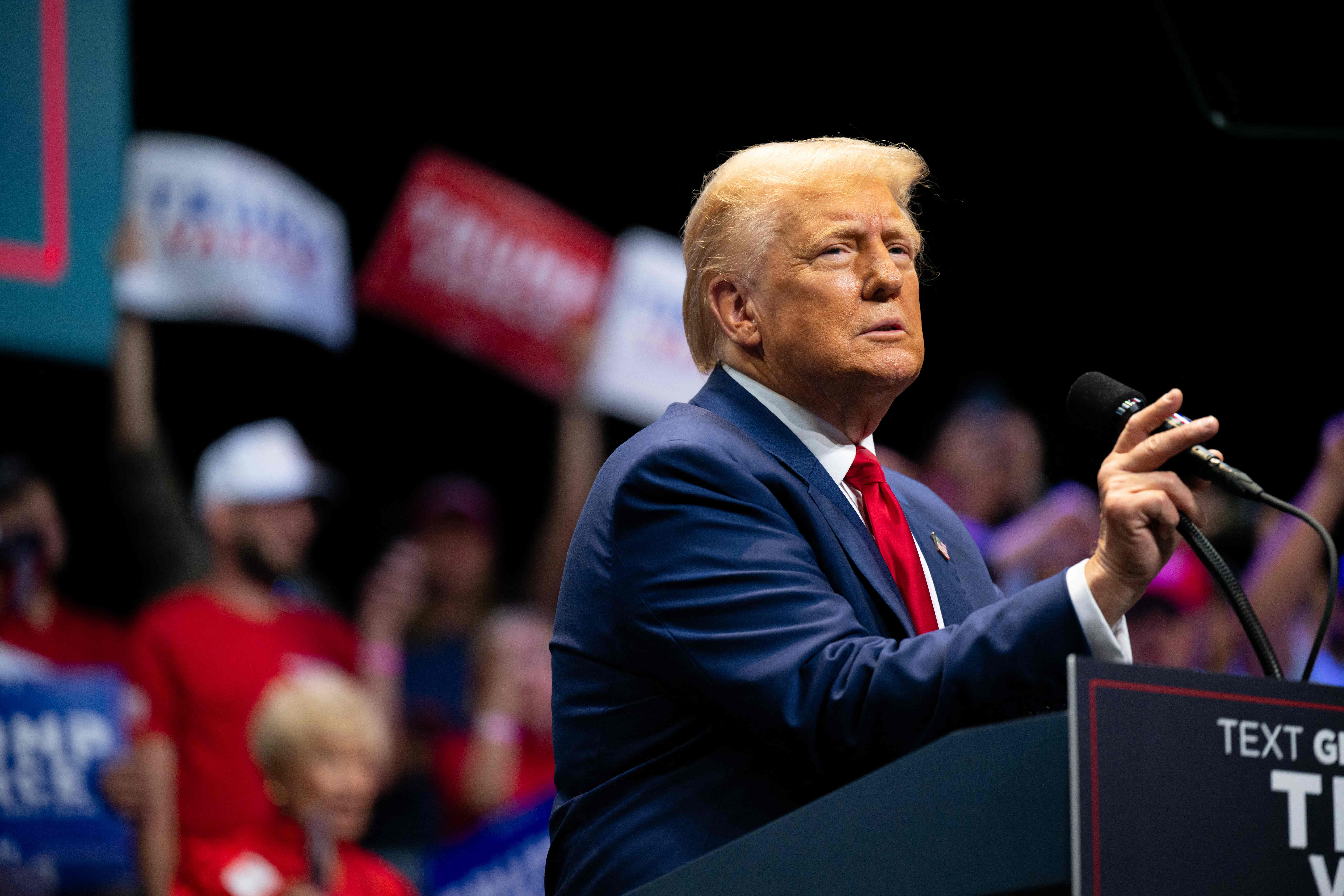 SAVANNAH, GEORGIA - SEPTEMBER 24: Republican Presidential candidate, former U.S. President Donald Trump speaks to attendees during a campaign rally at the Johnny Mercer Theatre on September 24, 2024 in Savannah, Georgia. The former president spoke to attendees on various plans including the tax code, U.S. manufacturing, and future economic opportunities if reelected for a second term. Trump continues campaigning around the country ahead of the November 6 presidential election.   Brandon Bell/Getty Images/AFP (Photo by Brandon Bell / GETTY IMAGES NORTH AMERICA / Getty Images via AFP)