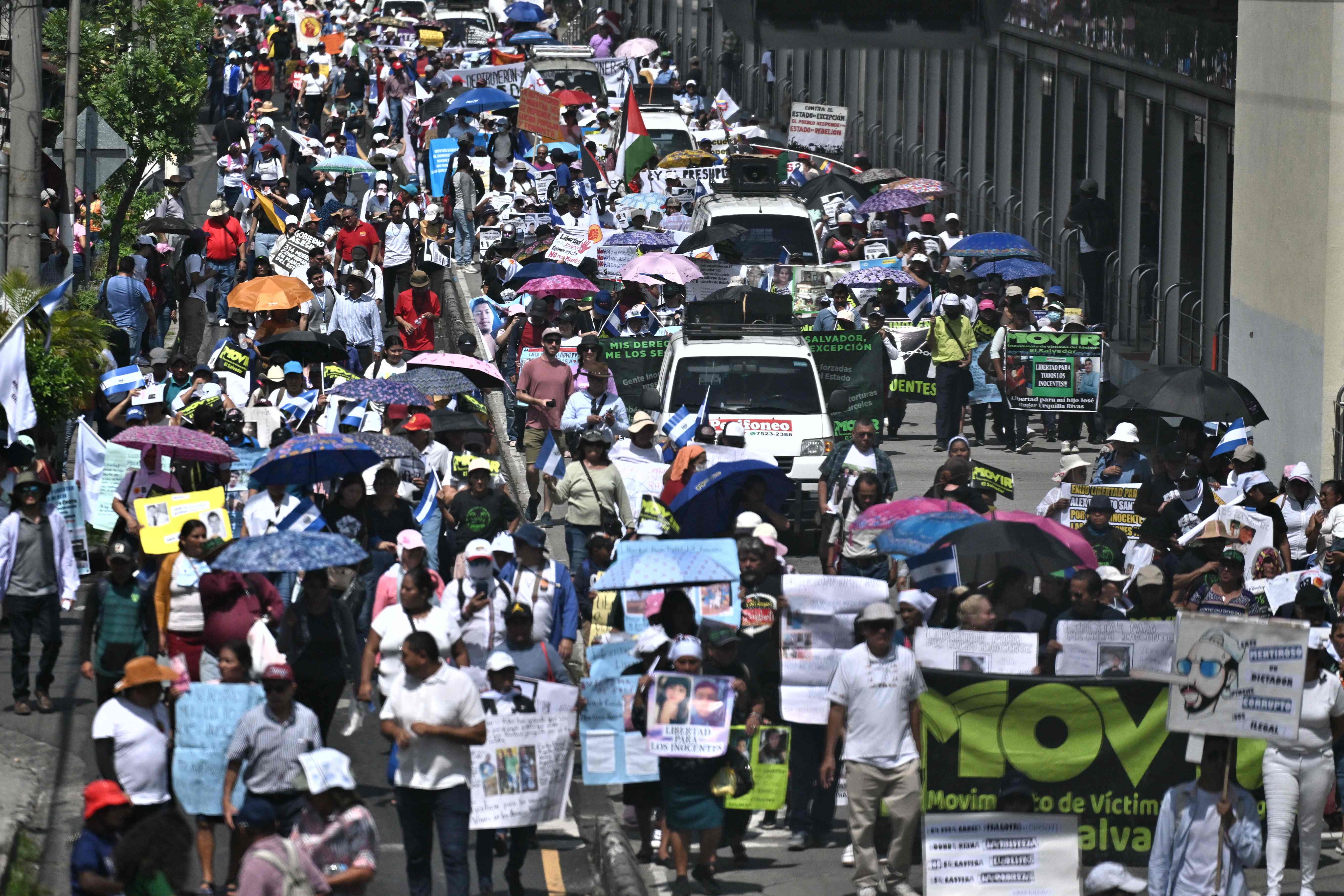 Demonstrator take part in a protest to demand the release of thousands of detainees by the government of Nayib Bukele in San Salvador on September 15, 2024. More than a thousand people marched this Sunday in El Salvador to demand the release of thousands of detainees they consider innocent victims in the war against gangs launched since 2022 by President Nayib Bukele. (Photo by Daniela RODRIGUEZ / AFP)