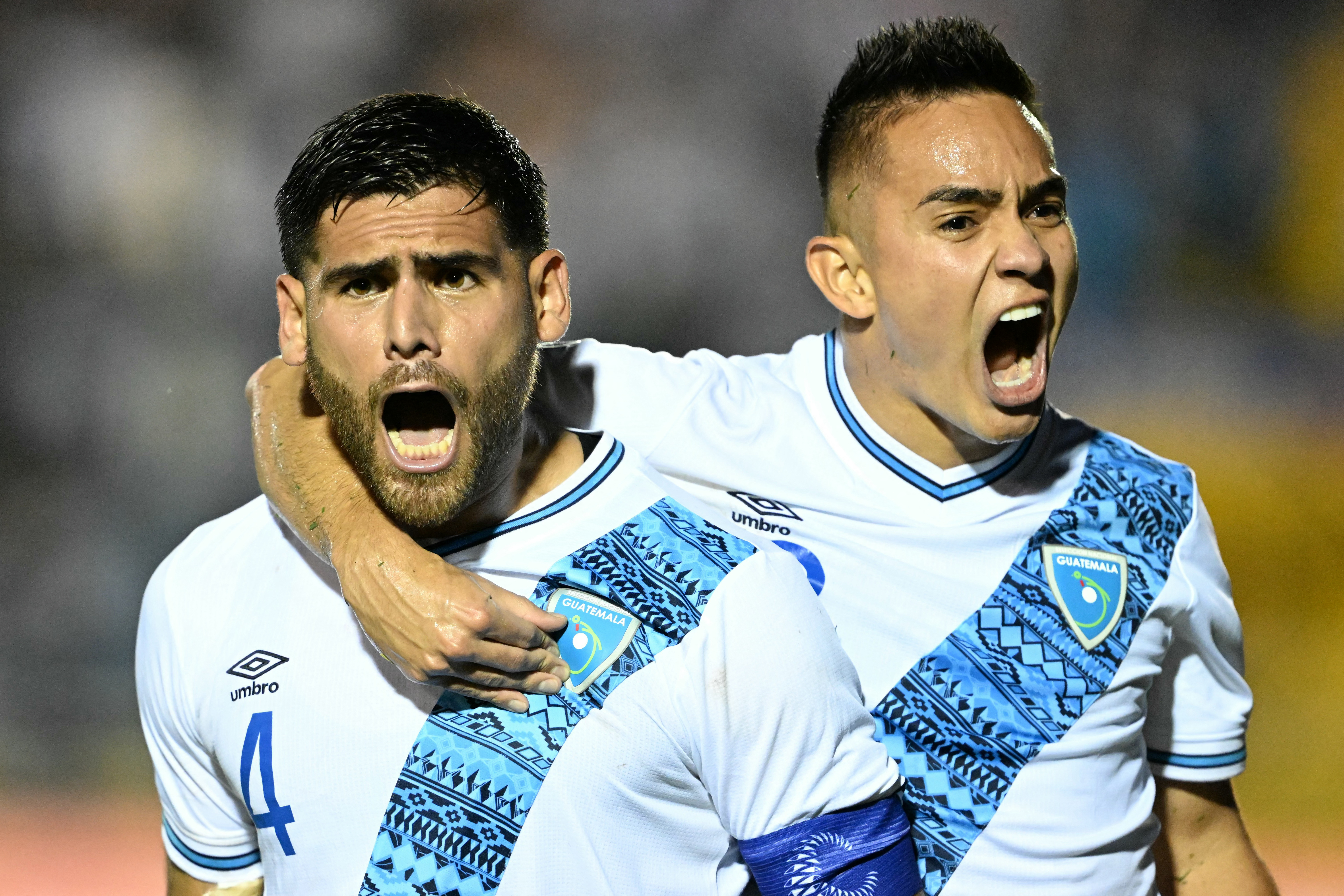 Guatemala's defender José Carlos Pinto (L) celebrates with teammate midfielder Oscar Santis after scoring during the Concacaf Nations League group stage football match between Guatemala and Martinique at the Doroteo Gamuch Flores stadium in Guatemala City, on September 5, 2024. (Photo by Johan ORDONEZ / AFP)