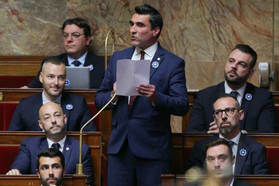 French far-right Rassemblement National (RN) party MP Michael Taverne delivers remarks during a session of questions to the government at The National Assembly in Paris on November 5, 2024. (Photo by Thomas SAMSON / AFP)