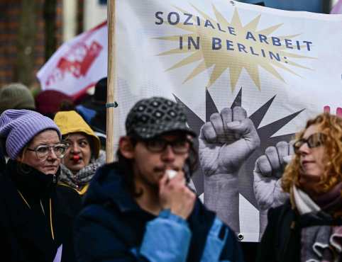 People carry banners reading "Social work in Berlin" during a protest under the motto "Uncuttable" against cuts in social work and youth welfare in the upcoming budget of Berlins senate on November 21, 2024 in Berlin.  (Photo by Tobias SCHWARZ / AFP)