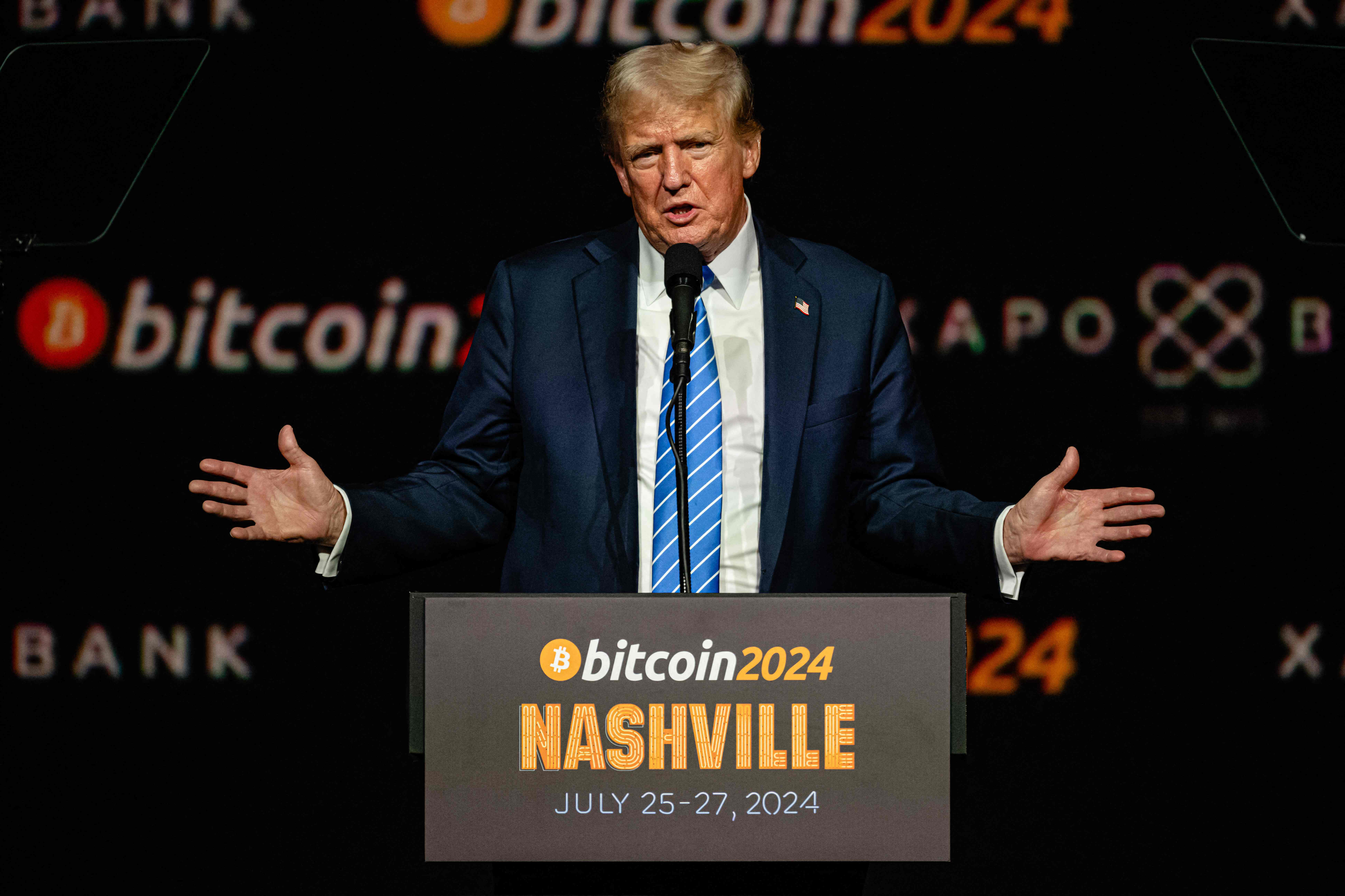 NASHVILLE, TENNESSEE - JULY 27: Former President and 2024 Republican presidential candidate Donald Trump gestures while giving a keynote speech on the third day of the Bitcoin 2024 conference at Music City Center July 27, 2024 in Nashville, Tennessee. The conference, which is aimed at bitcoin enthusiasts, features multiple vendor and entertainment spaces and seminars by celebrities and politicians.   Jon Cherry/Getty Images/AFP (Photo by Jon Cherry / GETTY IMAGES NORTH AMERICA / Getty Images via AFP)