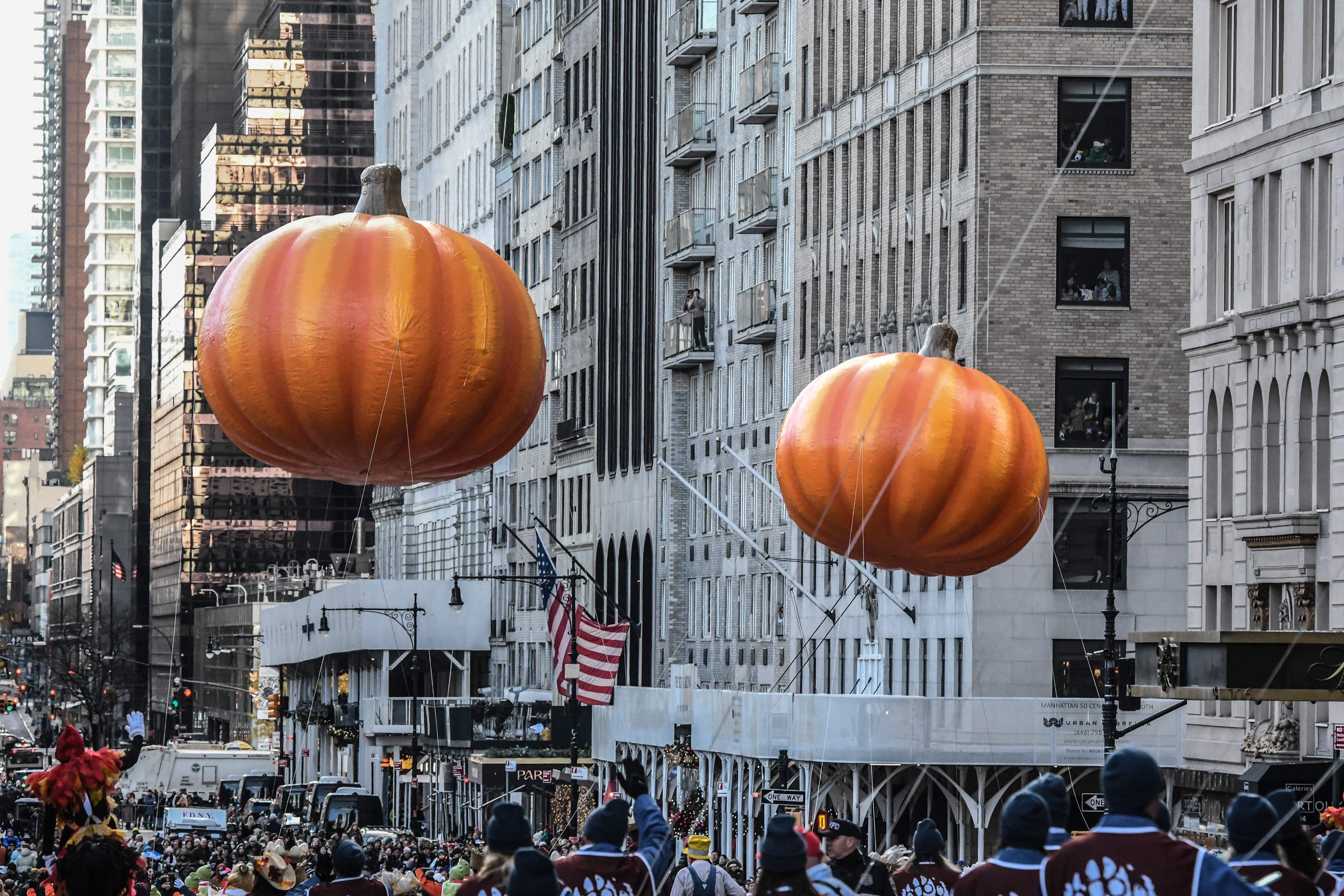 NEW YORK, NEW YORK - NOVEMBER 23: Pumpkin balloons float in Macy's annual Thanksgiving Day Parade on November 23, 2023 in New York City. Thousands of people lined the streets to watch the 25 balloons and hundreds of performers march in this parade happening since 1924.   Stephanie Keith/Getty Images/AFP (Photo by STEPHANIE KEITH / GETTY IMAGES NORTH AMERICA / Getty Images via AFP)