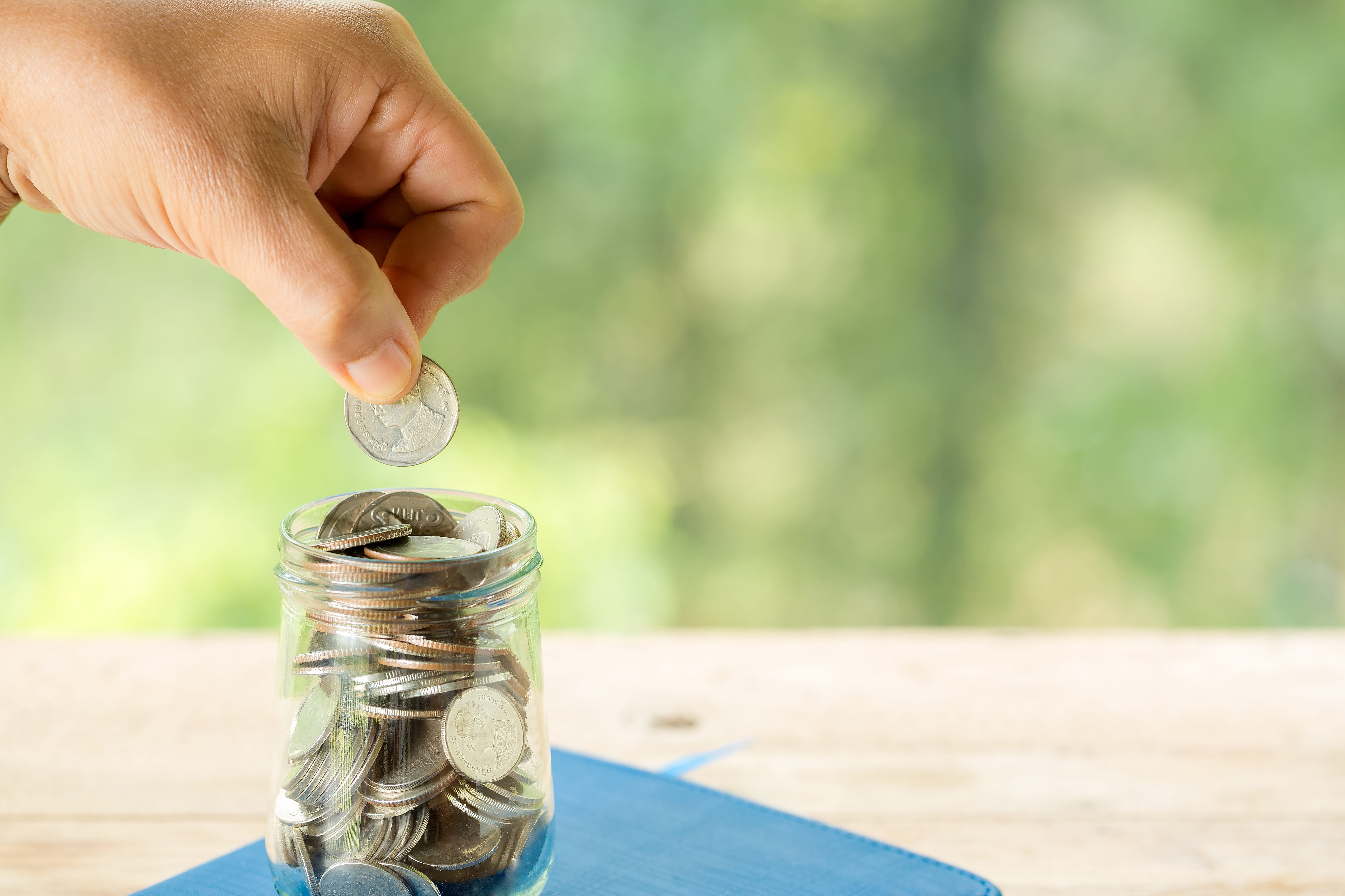 A close up of a bottle, coin, natural background