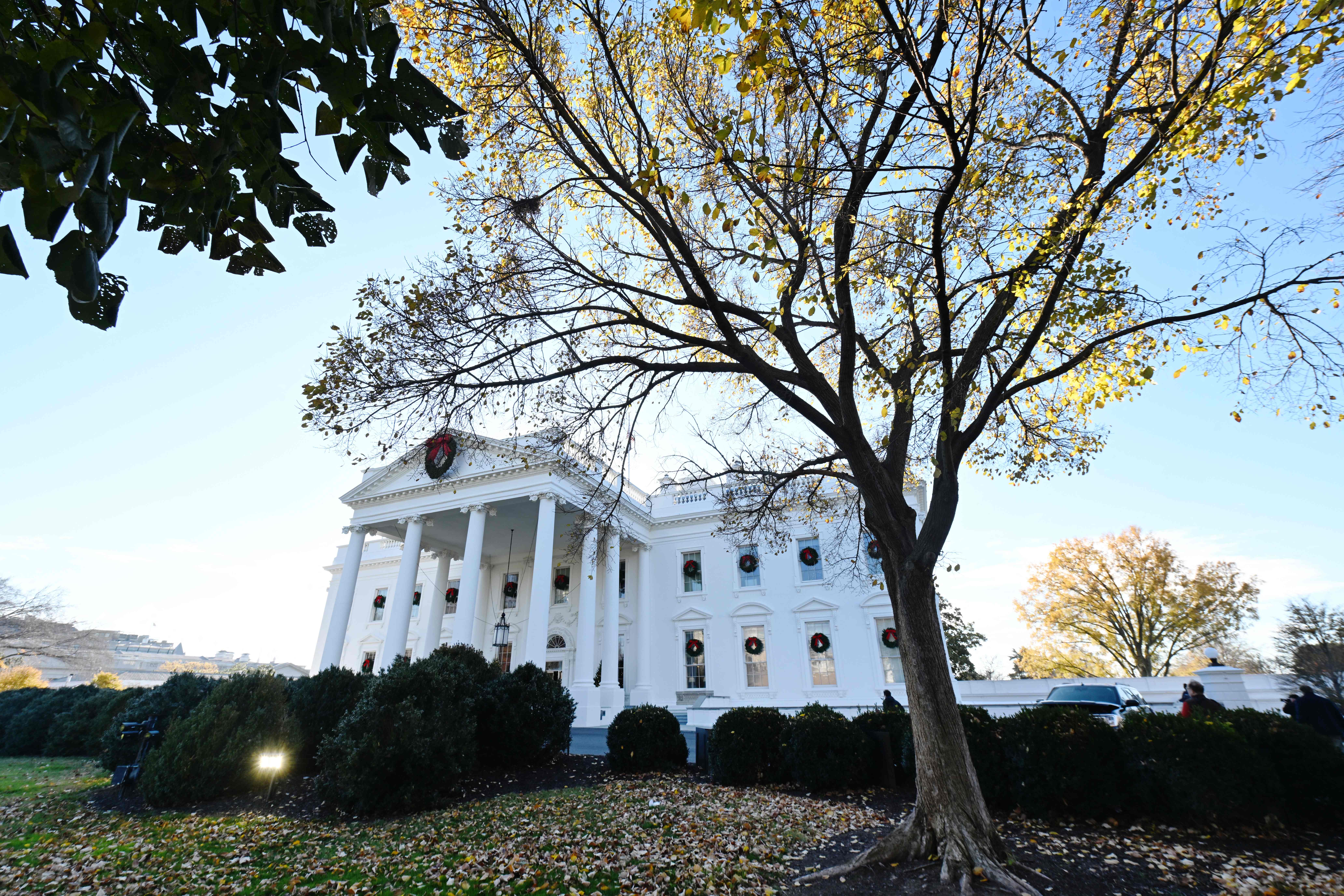 Christmas wreaths adorn the north portico of the White House on December 02, 2024. US First Lady Jill Biden announced the 2024 White House Holiday theme: A Season of Peace and Light. (Photo by ROBERTO SCHMIDT / AFP)