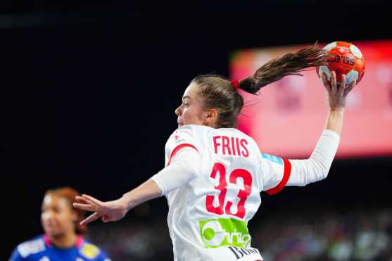 Denmark's wing #33 Emma Friis shoots the ball during the Women's semi-final of the European EHF EURO 2024 Handball Championship between France and Denmark in Vienna, Austria, on December 13, 2024. (Photo by Eva MANHART / APA / AFP) / Austria OUT