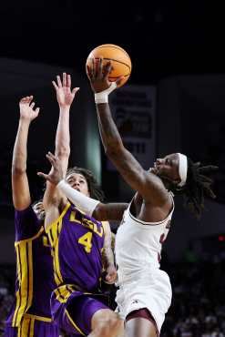 COLLEGE STATION, TEXAS - JANUARY 18: Manny Obaseki #35 of the Texas A&M Aggies goes up against Robert Miller III #6 and Dji Bailey #4 of the LSU Tigers during the first half at Reed Arena on January 18, 2025 in College Station, Texas.   Alex Slitz/Getty Images/AFP (Photo by Alex Slitz / GETTY IMAGES NORTH AMERICA / Getty Images via AFP)