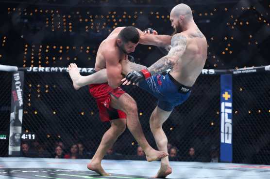 INGLEWOOD, CALIFORNIA - JANUARY 18: Zachary Reese of the United States kicks Azamat Bekoev of Russia in a middleweight fight during UFC 311 at Intuit Dome on January 18, 2025 in Inglewood, California.   Harry How/Getty Images/AFP (Photo by Harry How / GETTY IMAGES NORTH AMERICA / Getty Images via AFP)