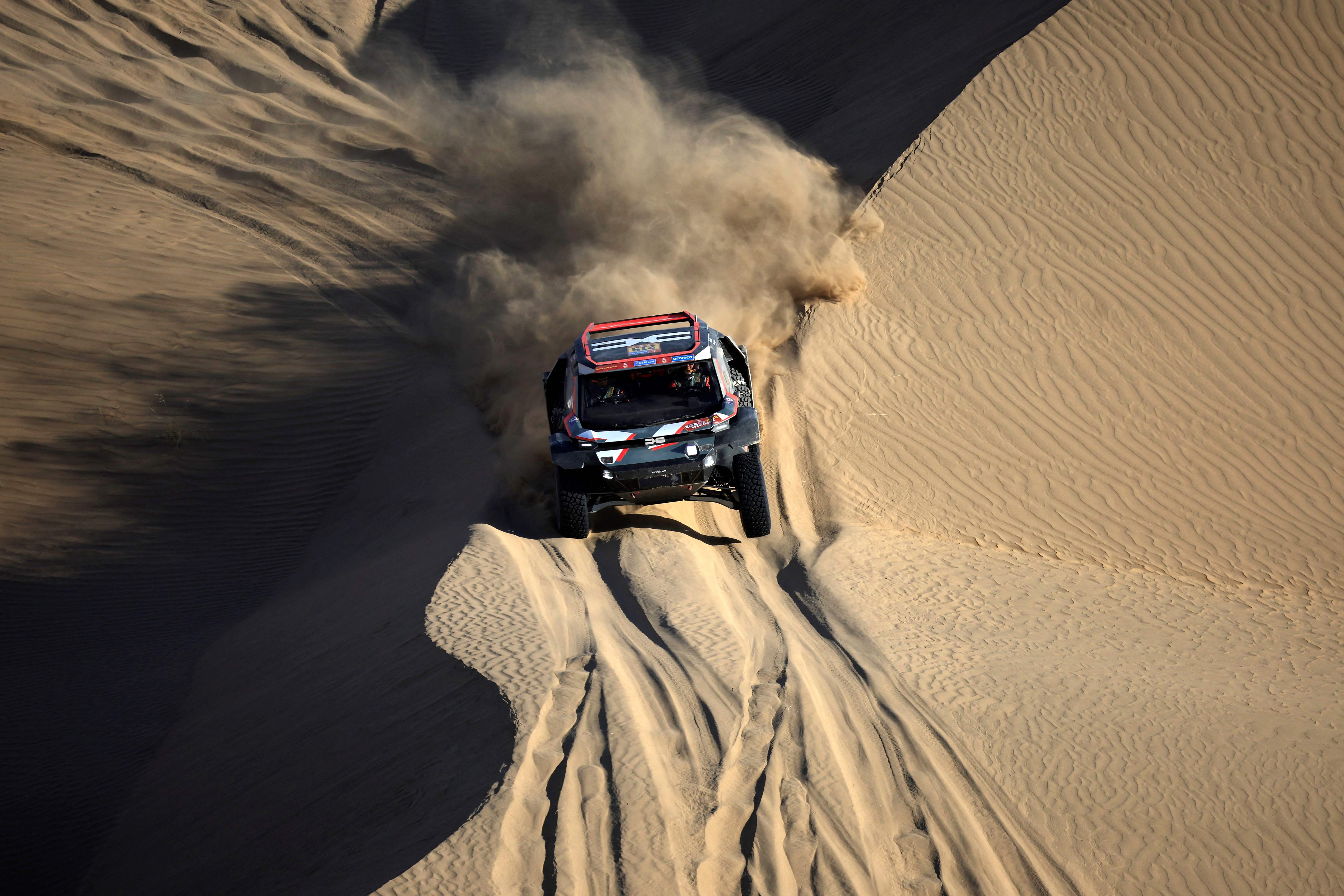 French driver Sebastien  Loeb steers his car assisted by co-driver Fabian Lurguin during stage 2B of the 47th Dakar Rally between Bisha and Bisha, on January 6, 2025. (Photo by Valery HACHE / AFP)