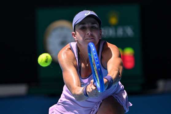 Switzerland's Belinda Bencic hits a shot against USA's Coco Gauff during their women's singles match on day eight of the Australian Open tennis tournament in Melbourne on January 19, 2025. (Photo by WILLIAM WEST / AFP) / -- IMAGE RESTRICTED TO EDITORIAL USE - STRICTLY NO COMMERCIAL USE --