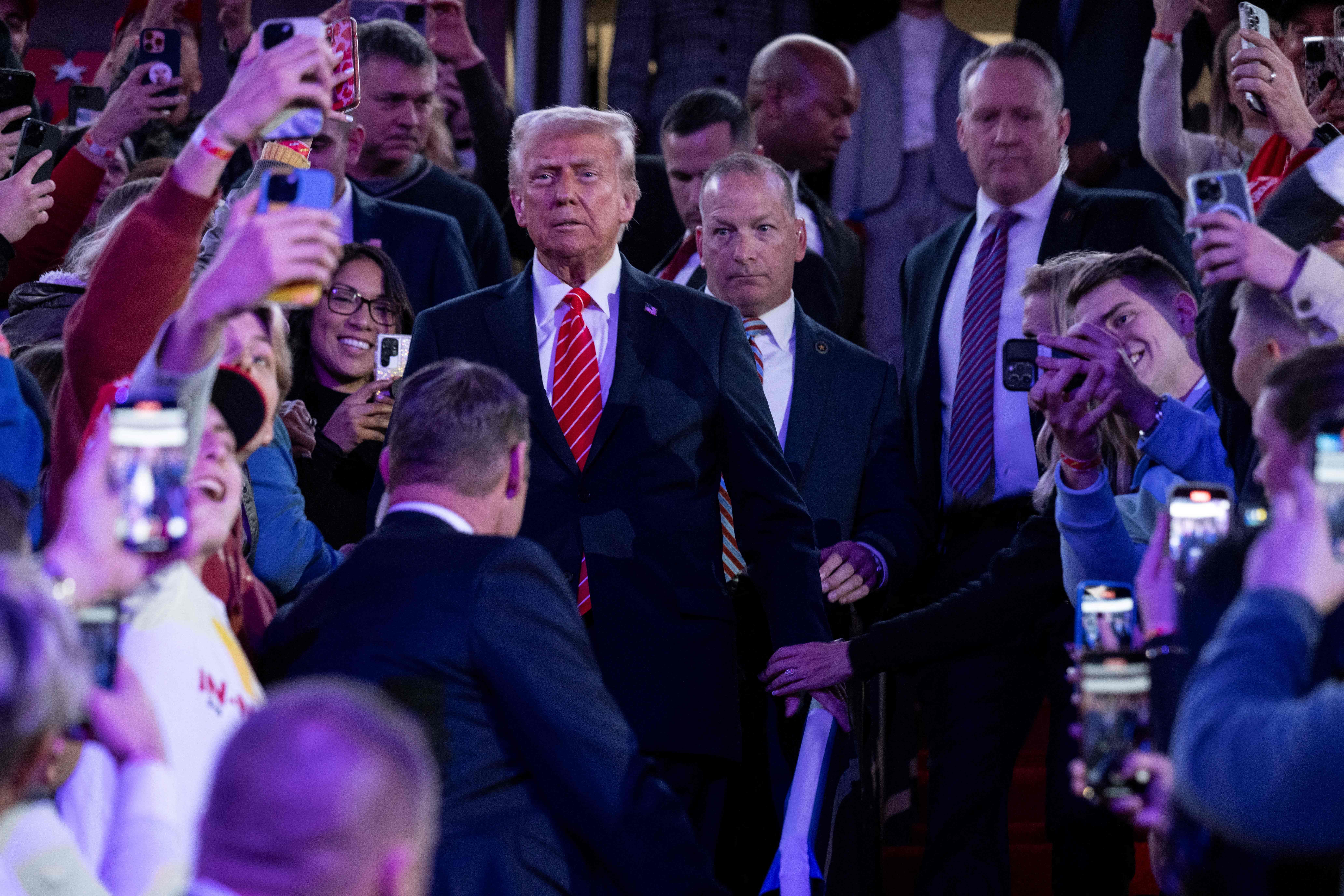 US President-elect Donald Trump arrives to speak at a MAGA victory rally at Capital One Arena in Washington, DC on January 19, 2025, one day ahead of his inauguration ceremony. (Photo by Jim WATSON / AFP)